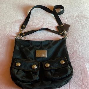 Black Coach poppy purple satin inside beautiful condition! No stains or tears